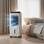 Portable air conditioner in a bedroom setting with a bed and curtains in the background.