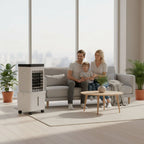 Family sitting on a couch in a modern living room with an air cooler.