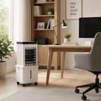 A white and black portable air conditioner cooling desk in a modern home office setting with a wooden desk, gray office chair, and bookshelves.
