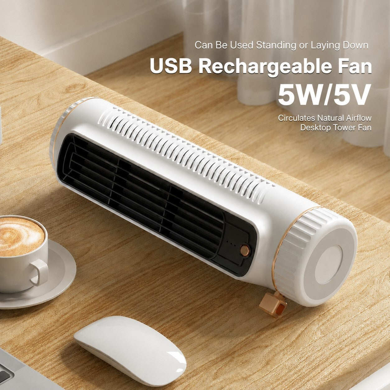 A white USB rechargeable tower fan with a black front grille and a small copper accent, shown on a wooden desk next to a coffee cup and mouse. Text on the image reads 'USB Rechargeable Fan 5W/5V'.